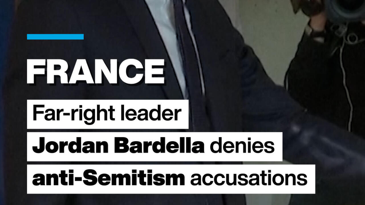 Headline graphic over a cropped image of a man in a suit beside another person.