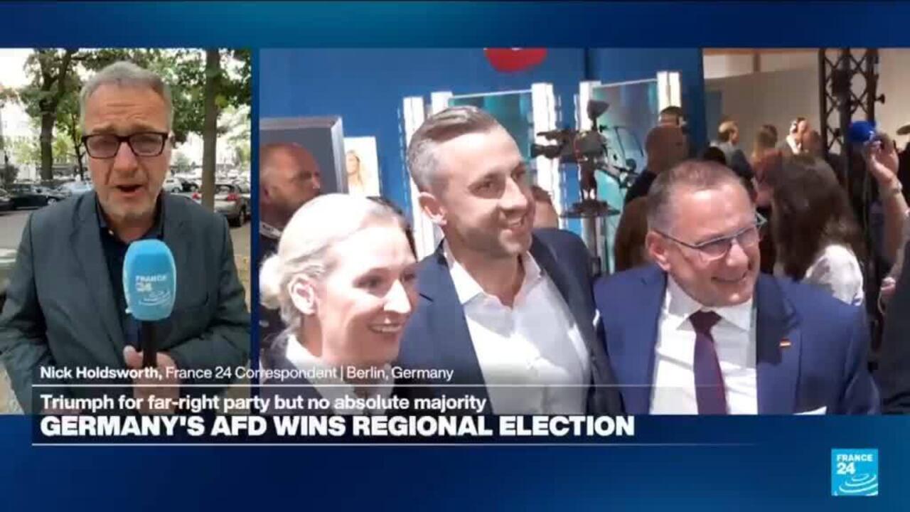 France 24 broadcast shows a reporter beside three people at a political event.