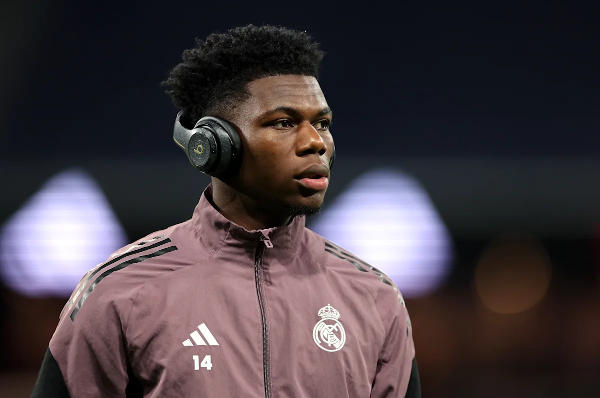 Real Madrid player wearing number 14 and headphones during training
