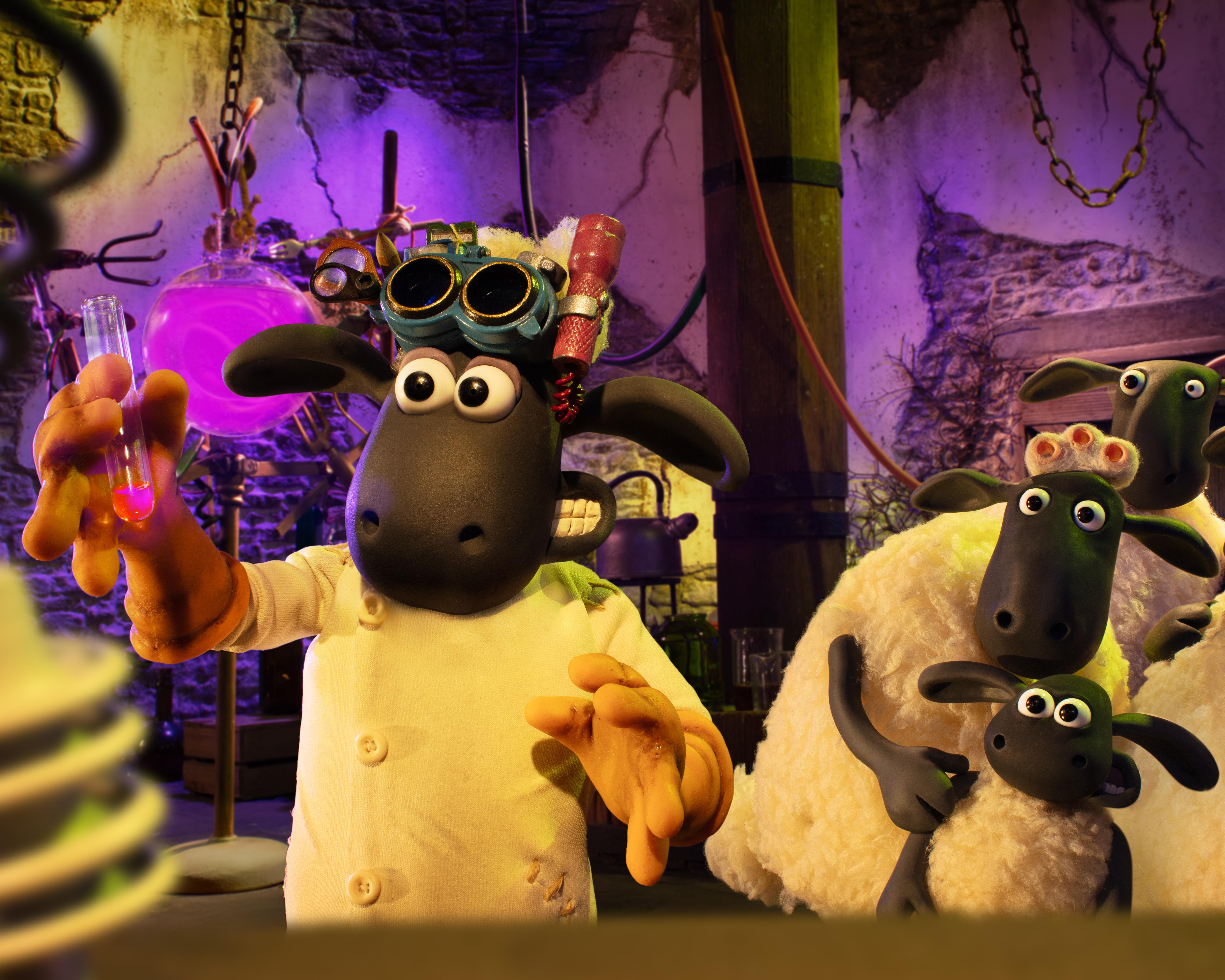 Claymation sheep characters gather in a purple-lit laboratory beside a scientist wearing goggles and a white coat