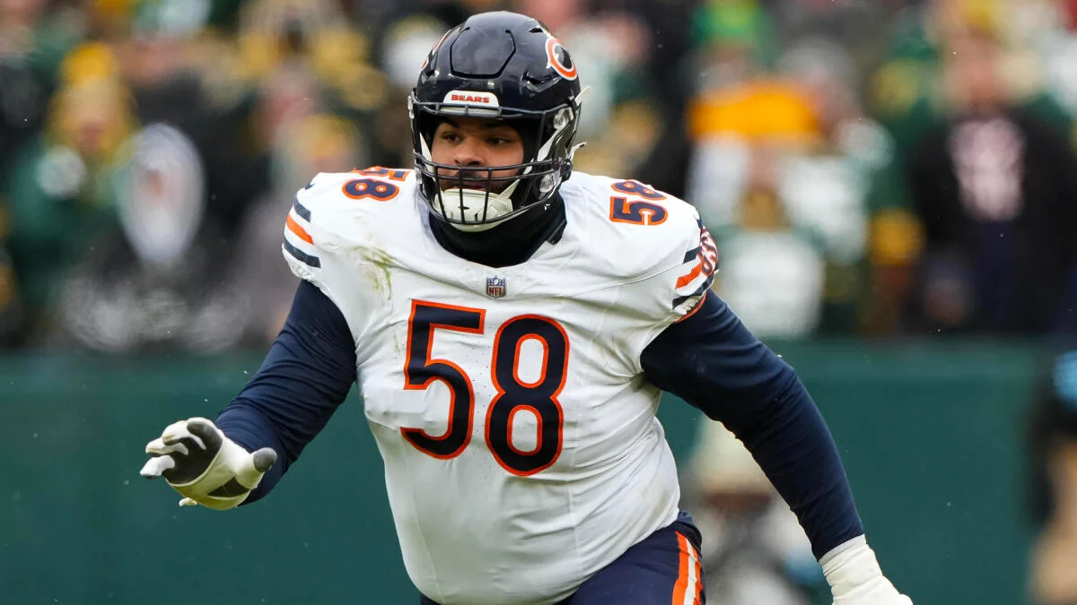 Chicago Bears player wearing number 58 runs on a football field during a game.
