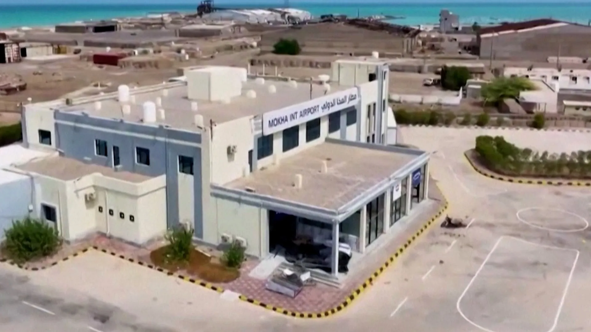 Aerial view of Mocha International Airport terminal beside the turquoise coast