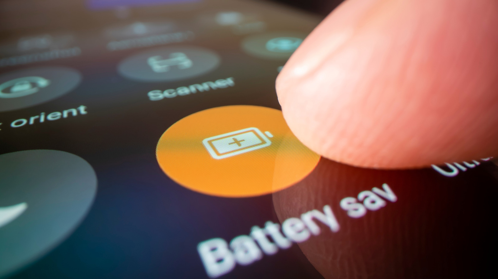 A fingertip presses an orange battery icon on a smartphone settings screen.