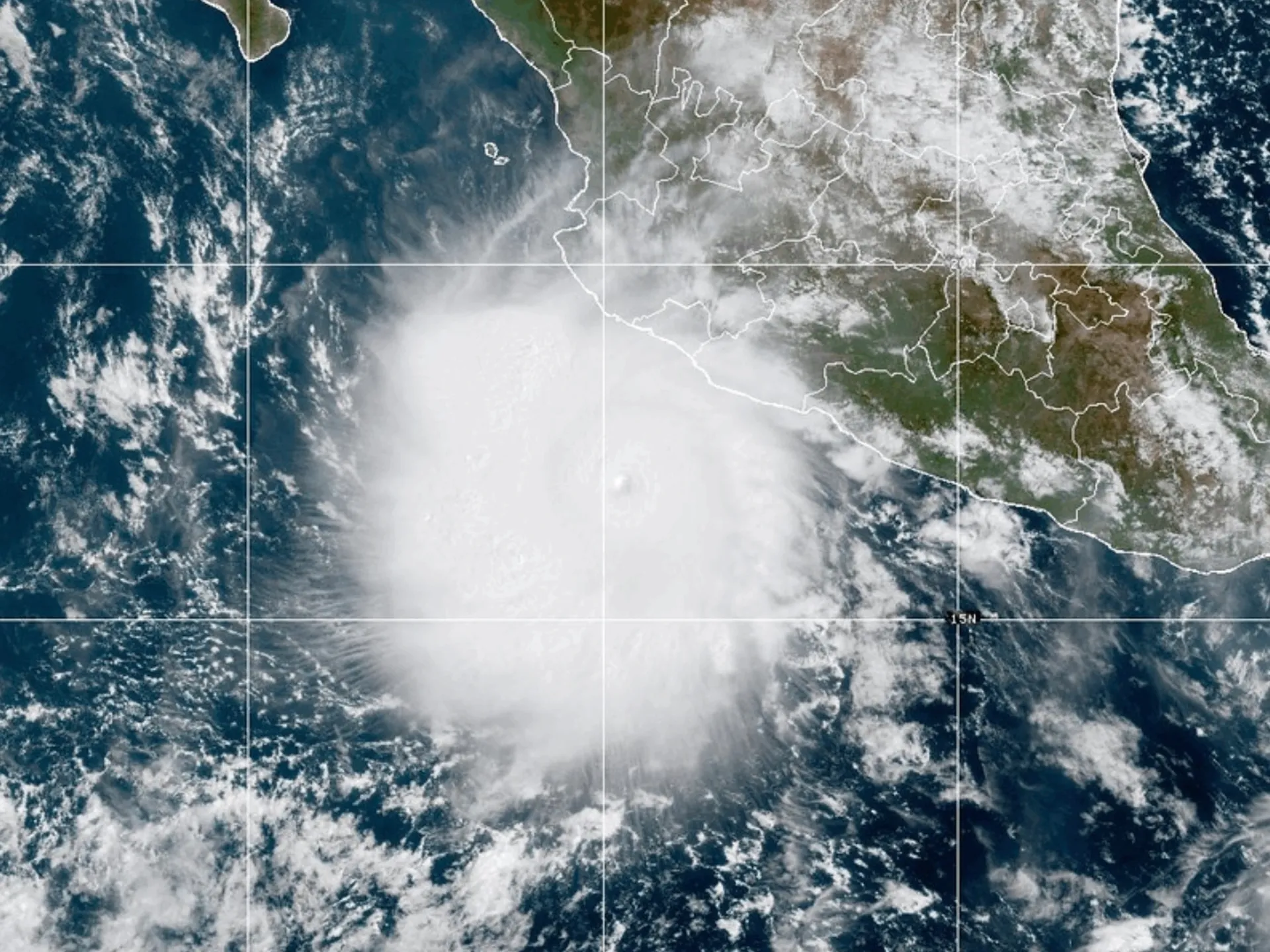 Satellite image shows a broad swirling cloud system over the eastern Pacific near Central America.