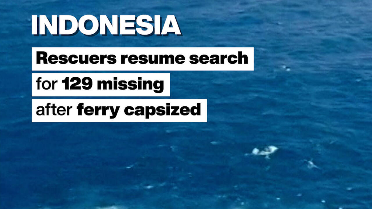 Aerial view of dark blue ocean water with overlaid text about Indonesia’s missing ferry passengers.