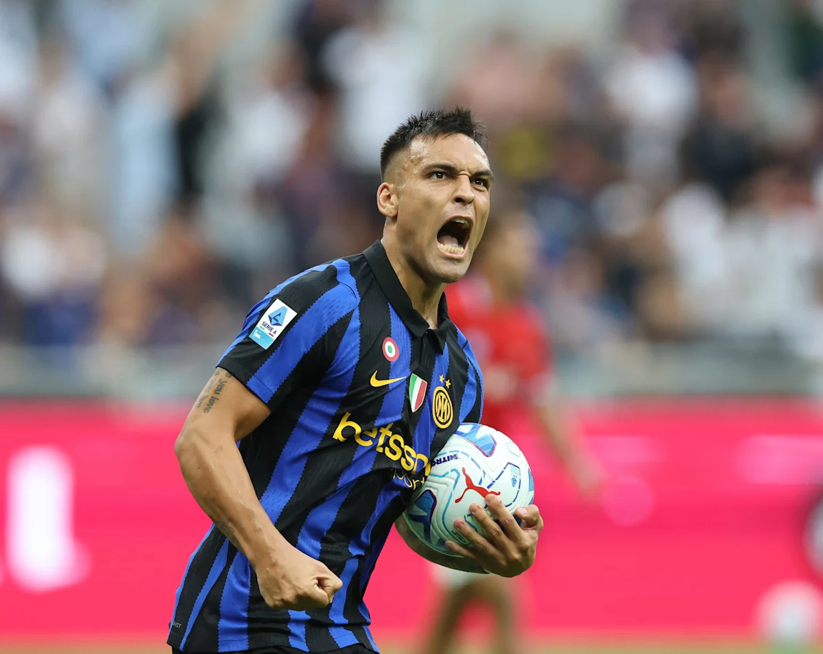 Inter Milan footballer shouting while carrying a ball during a match
