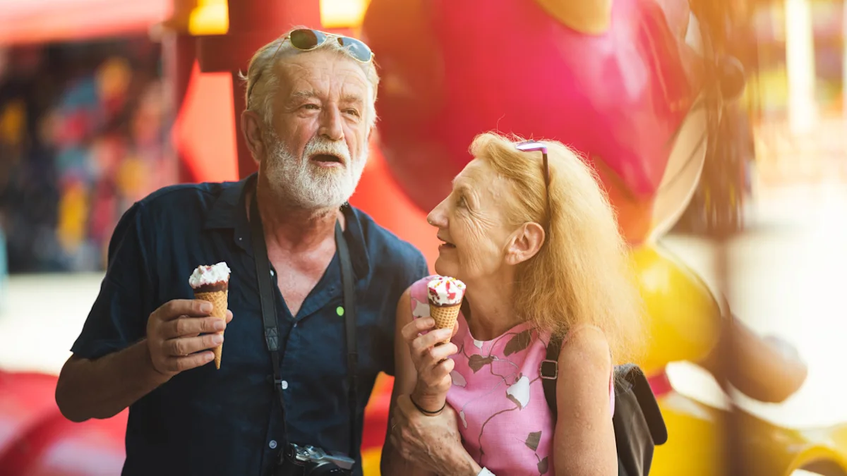 Older couple smiling and holding ice cream cones outdoors in warm, colorful surroundings.