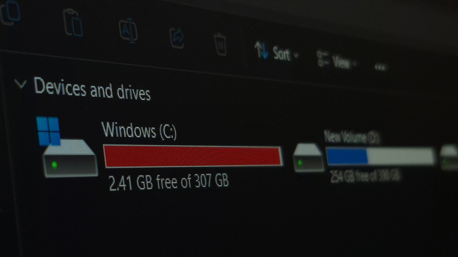 Close-up of Windows File Explorer showing nearly full C: drive and partially used New Volume (D:).