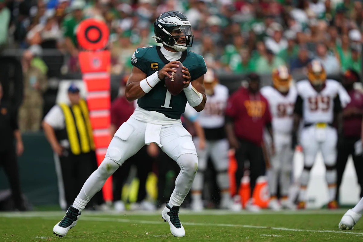 Philadelphia Eagles quarterback holds the football while preparing to throw during a game.