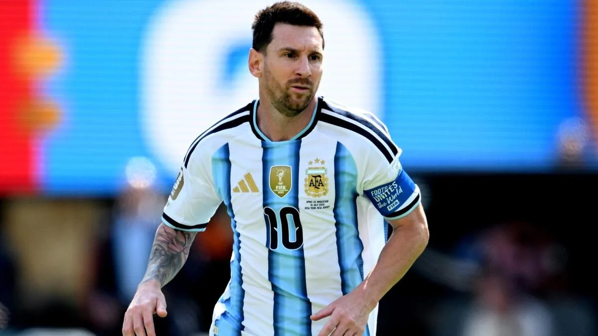 Lionel Messi wearing Argentina’s national team jersey and running during a football match
