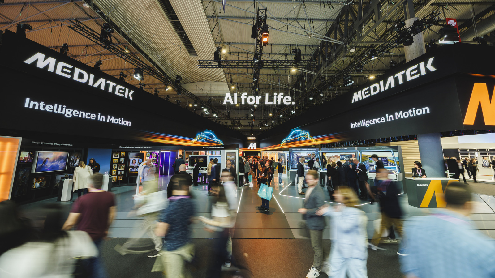 MediaTek exhibition booth with AI displays and visitors walking through a brightly lit trade show hall