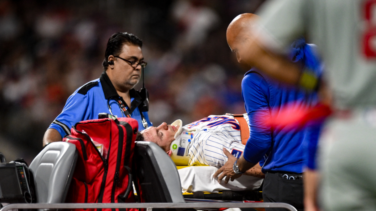 Mets' Jared Young carted off field after colliding with Nolan McLean during play at first base