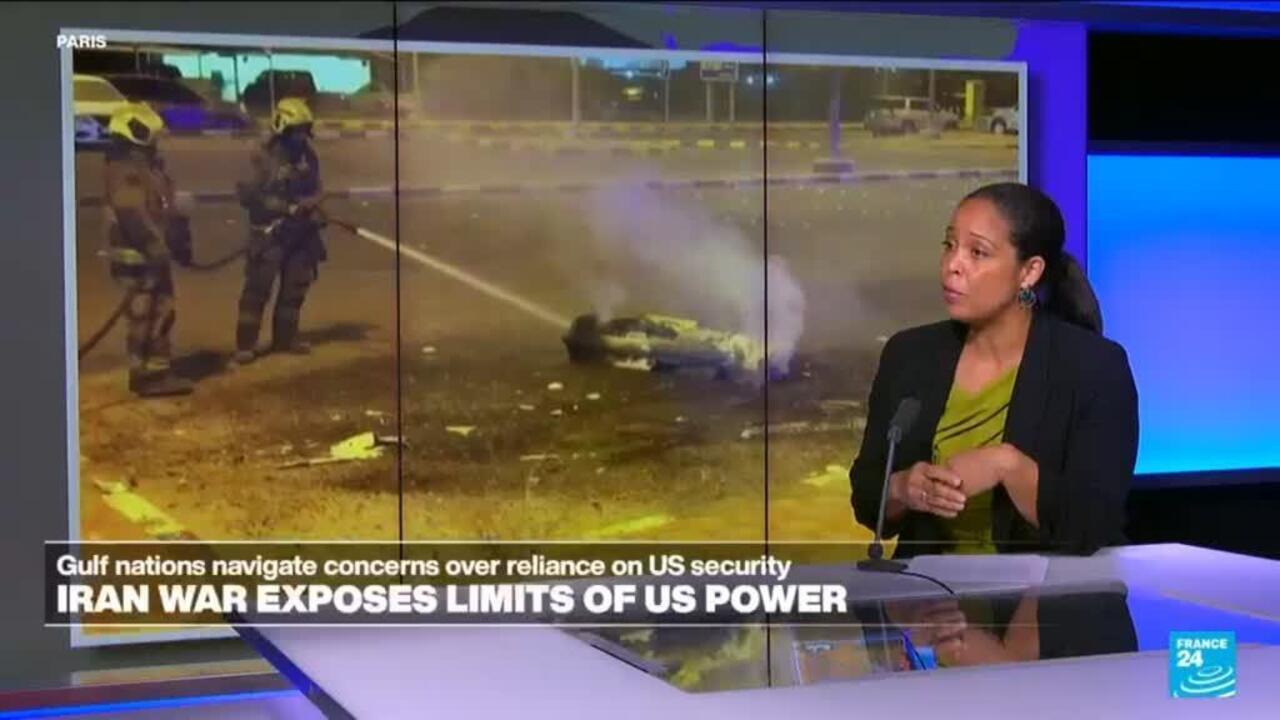 News presenter beside footage of firefighters extinguishing a burning object at night