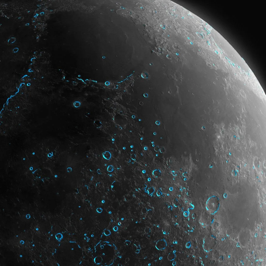 Close-up of the cratered Moon with vivid blue highlights tracing numerous crater rims
