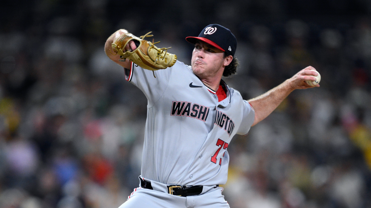 Washington Nationals pitcher in gray uniform throws a baseball during a game