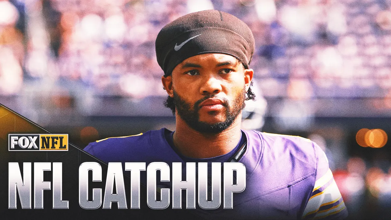 Bearded football player in purple jersey and black headband standing before a blurred stadium crowd