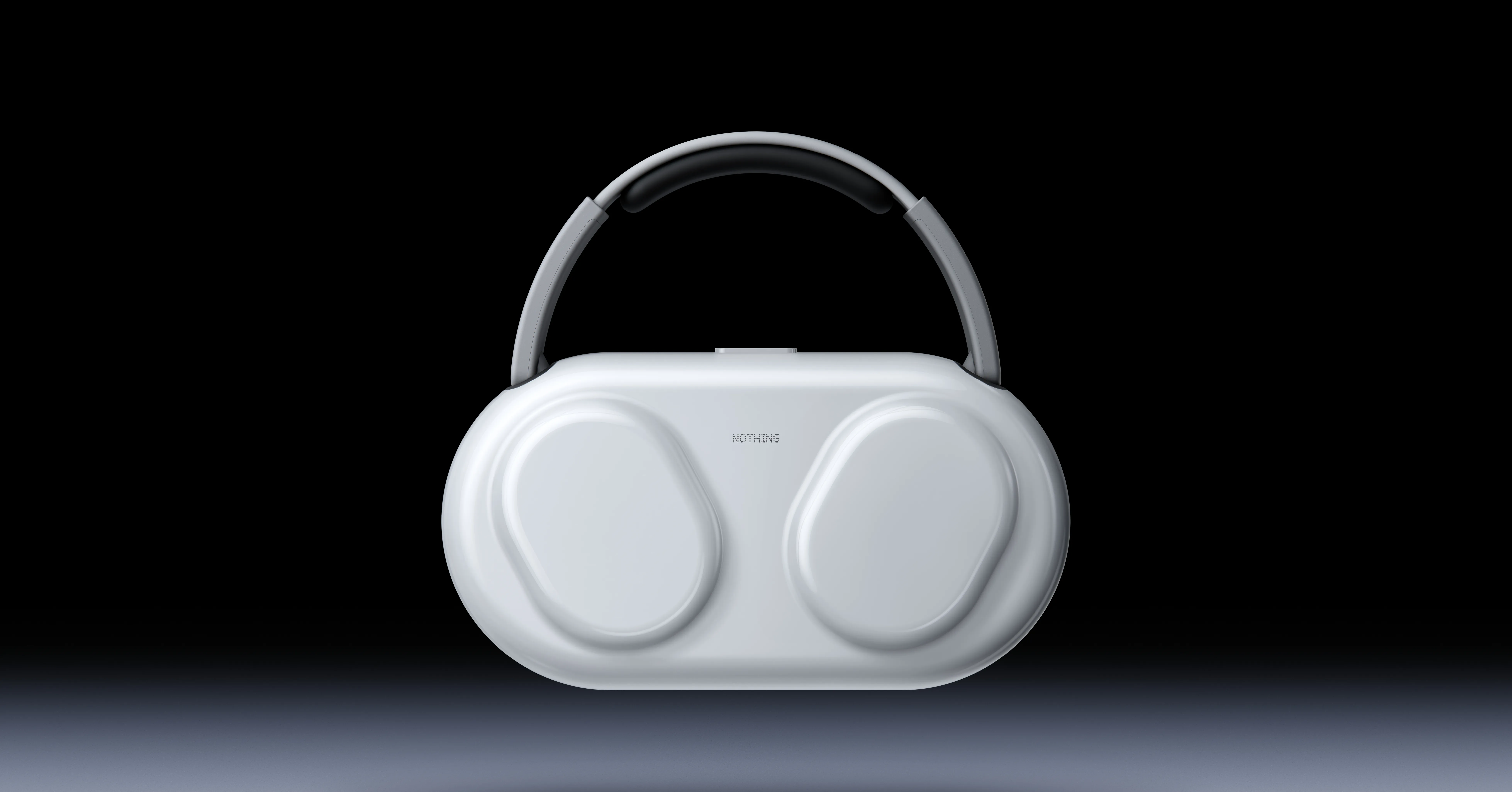 White Nothing-branded over-ear headphones with a dark headband against a black-to-gray background.