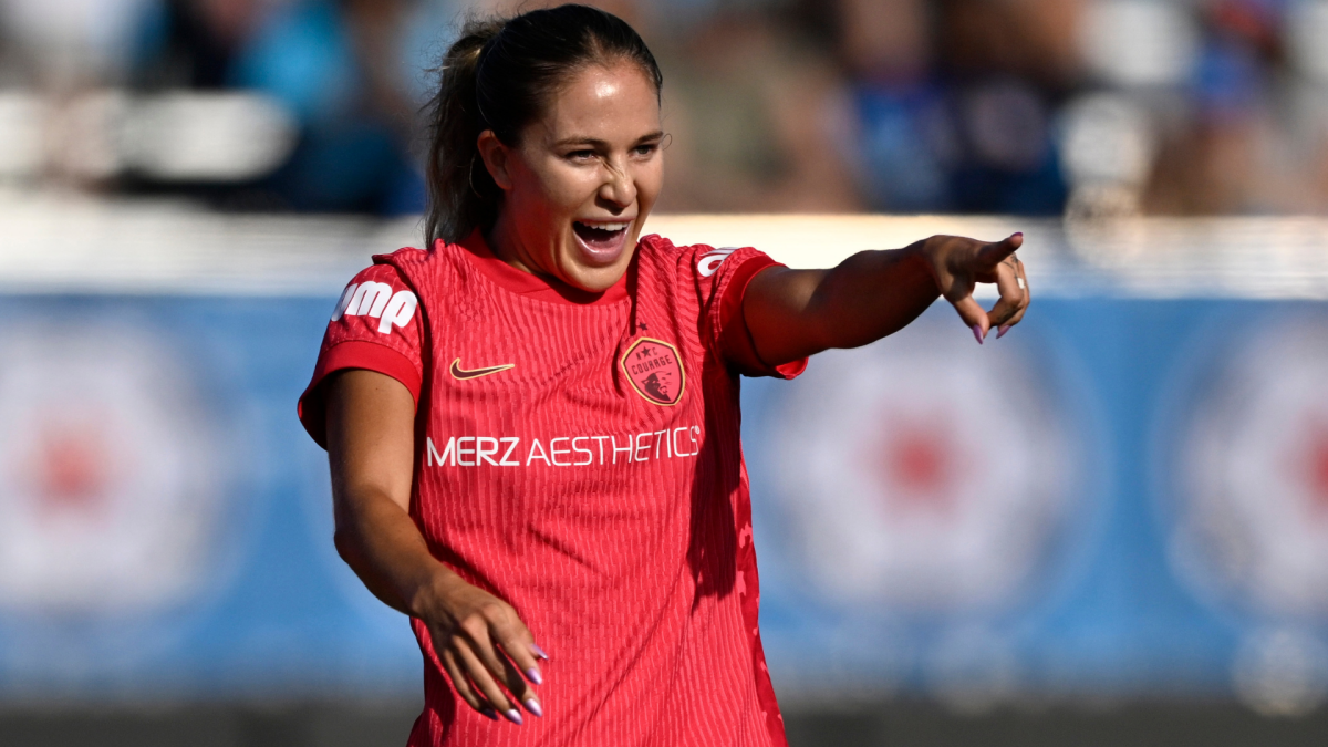 North Carolina Courage soccer player in a red jersey points during a match