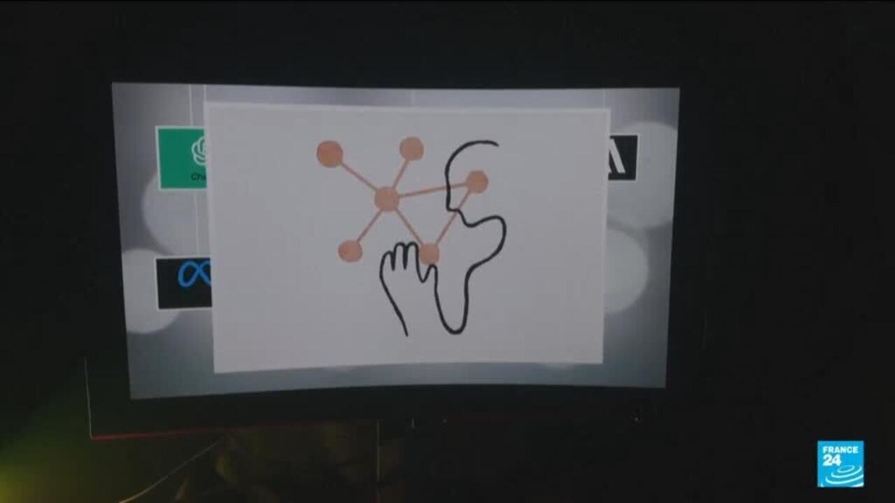Screen displays a stylized network diagram beside a profile outline and reaching hand.