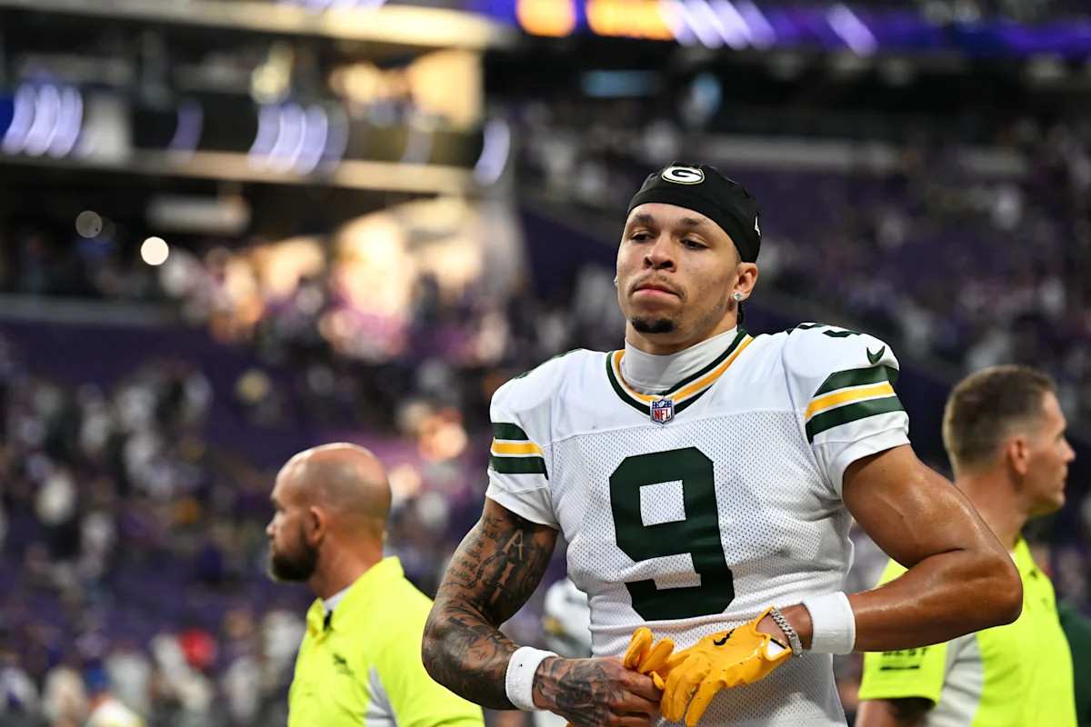 Green Bay Packers player wearing number 9 stands on the football field during a game.
