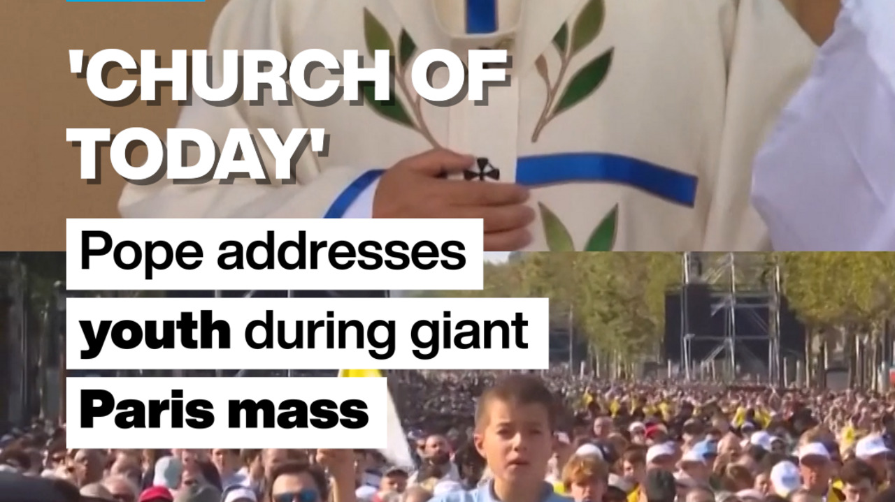 A priest in white vestments appears above a large outdoor crowd, with a young boy in the foreground.