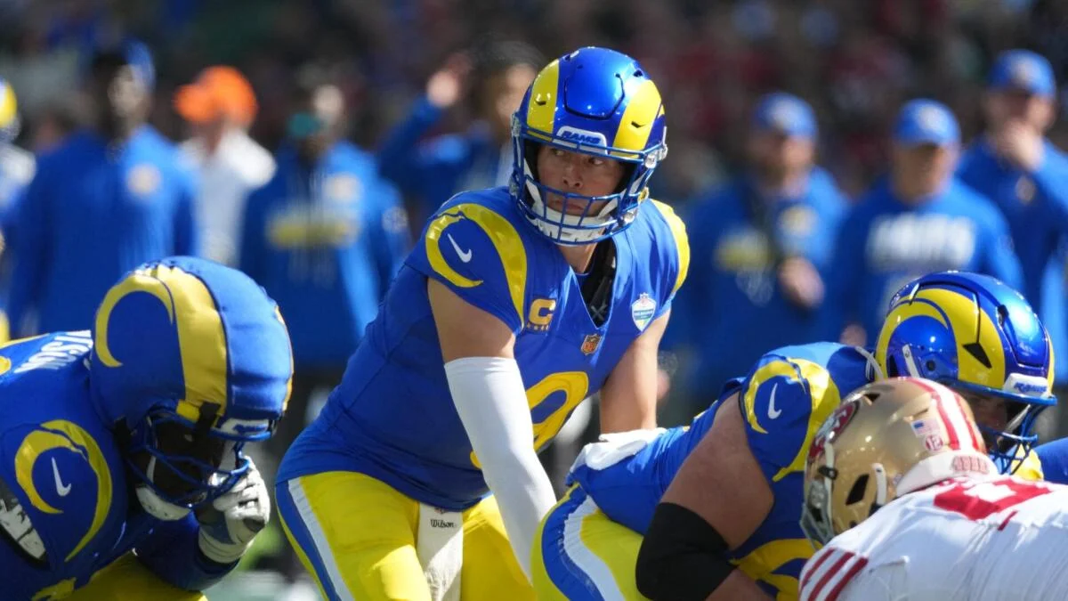 Los Angeles Rams players line up against an opposing offense during a football game