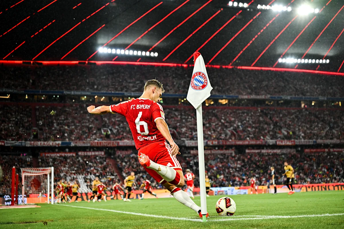 Bayern player in red jersey celebrates near the corner flag during a match
