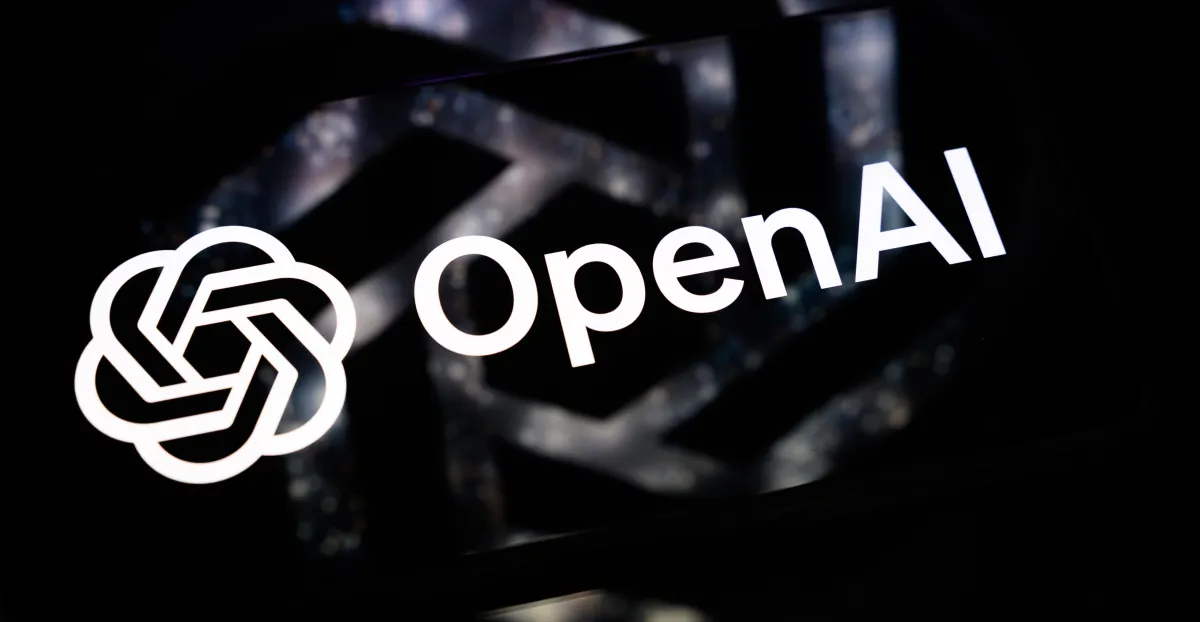 OpenAI logo and wordmark appear in white against a dark, blurred background.