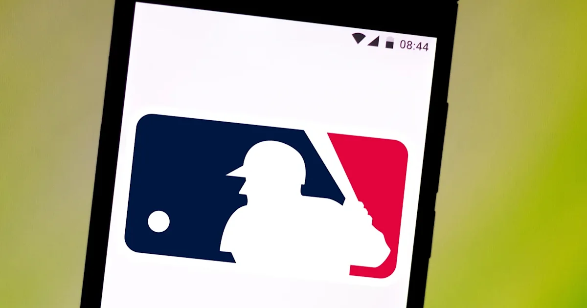 A tilted smartphone displays the Major League Baseball logo against a yellow-green background.