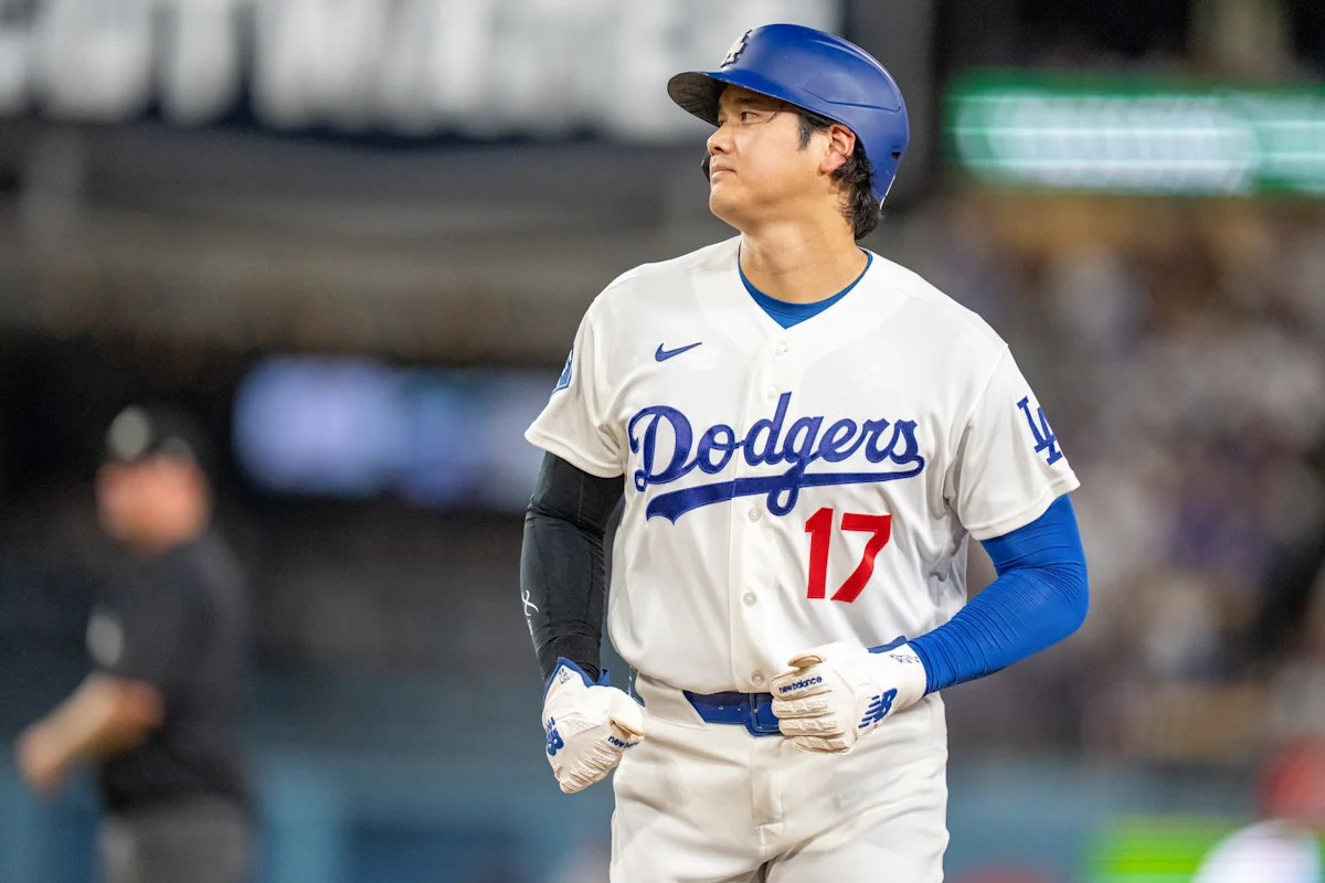 Los Angeles Dodgers player in uniform and helmet standing on the field during a game