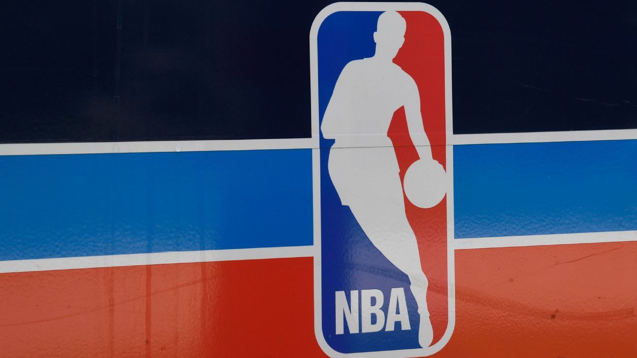 NBA logo on a red, white, and blue court-side panel beneath a dark background