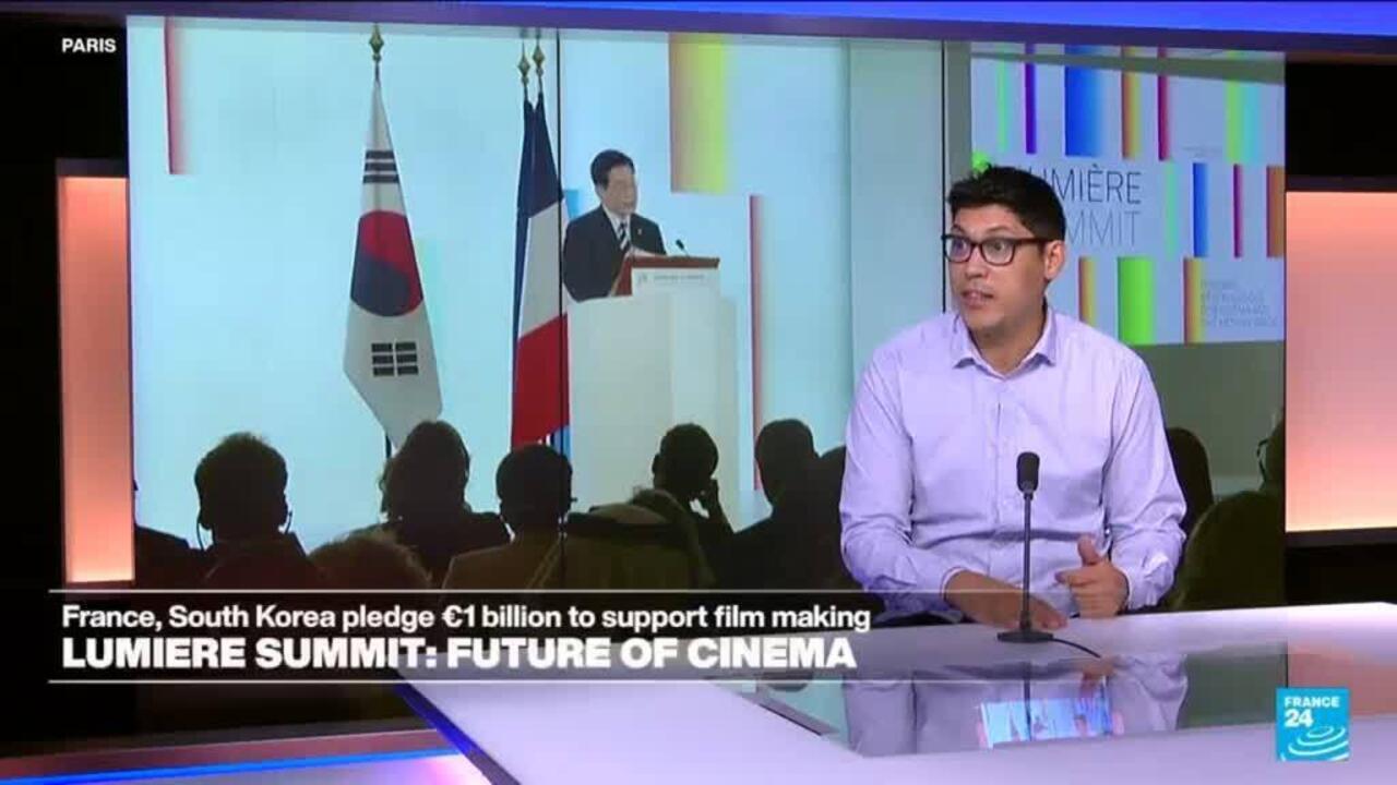 France 24 presenter speaks beside footage of a cinema summit with French and South Korean flags.
