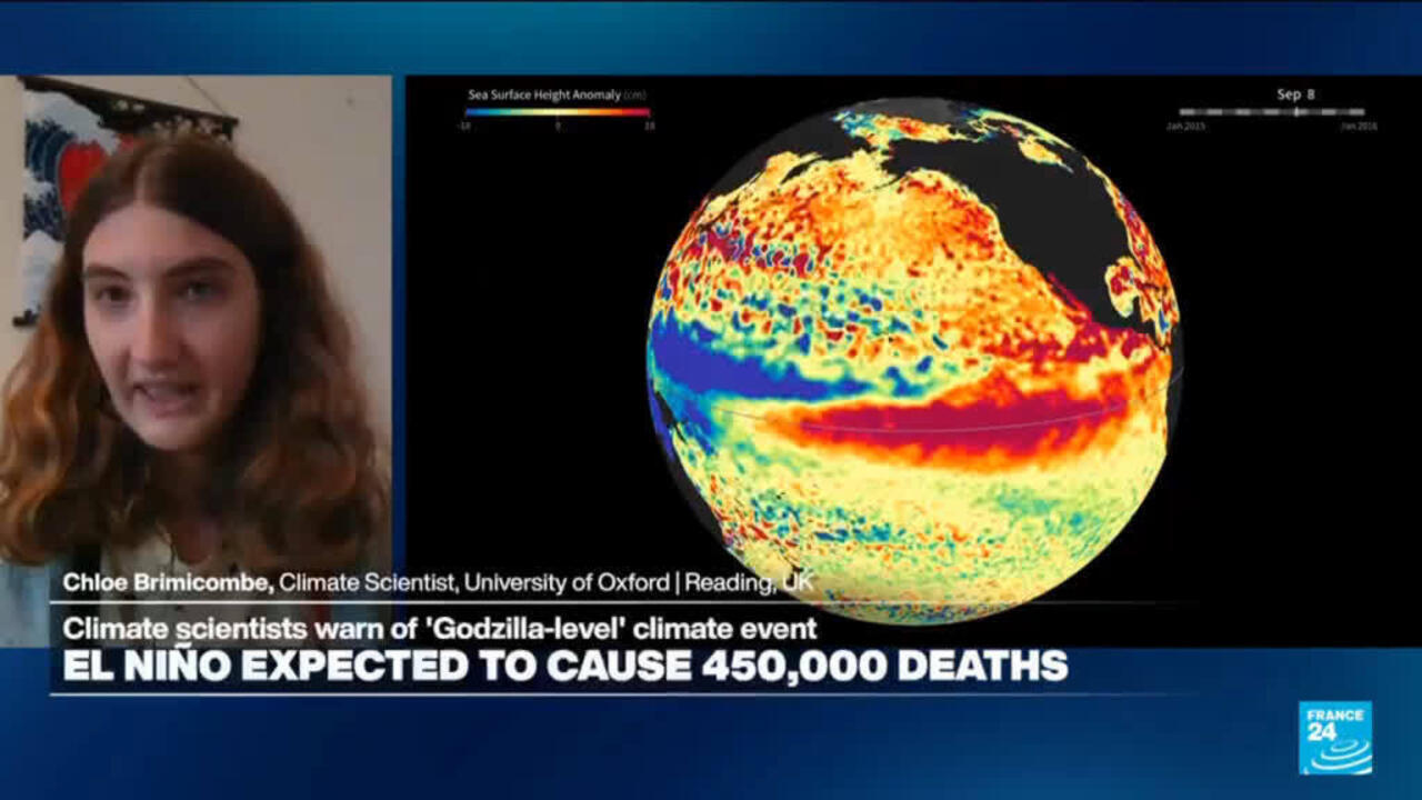 News broadcast shows a climate scientist beside a colorful globe map of sea surface height anomalies.