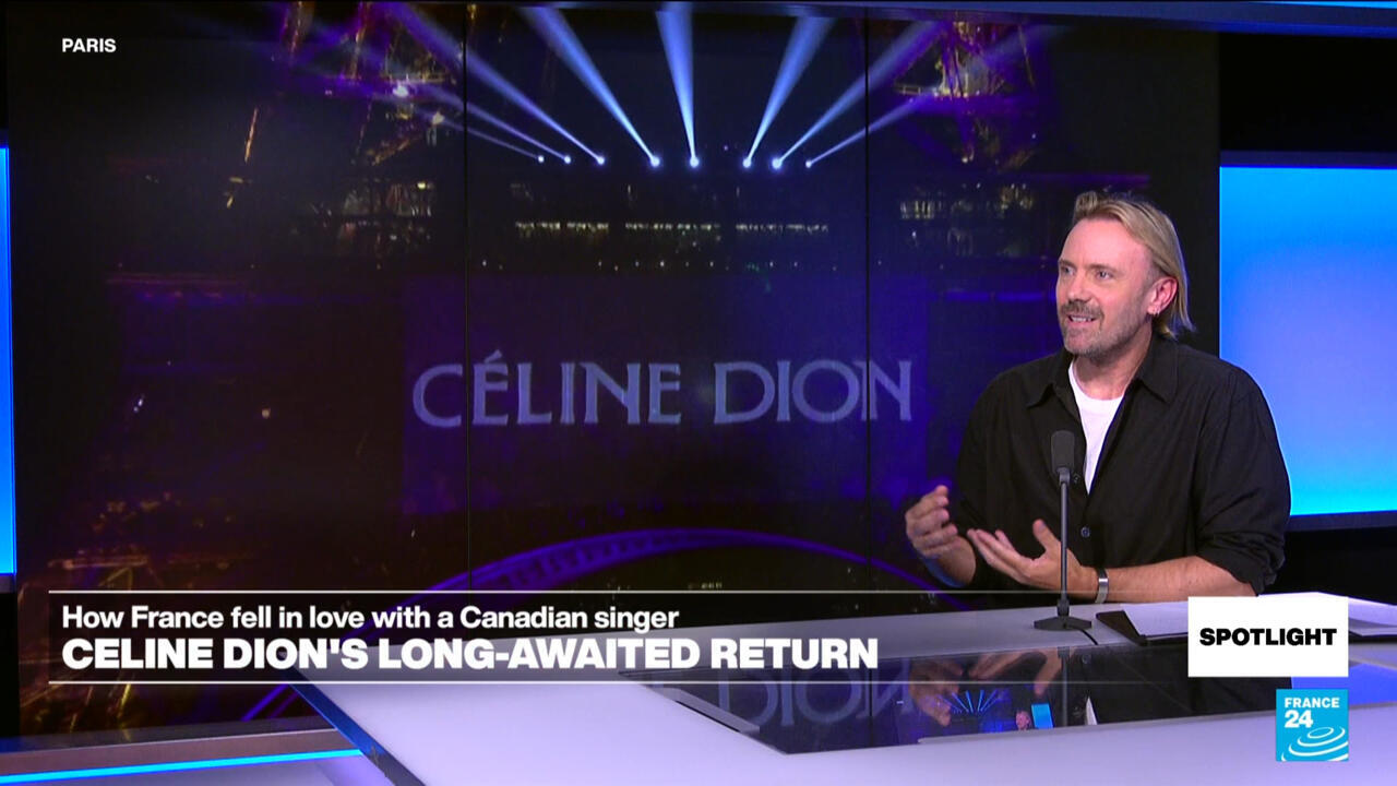 Blond man speaks at a desk beside a screen displaying Celine Dion’s name and France 24 graphics.