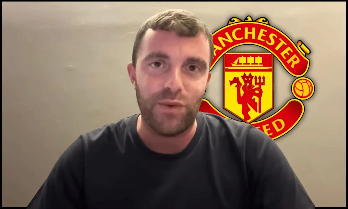 Man speaking to camera in front of a Manchester United crest