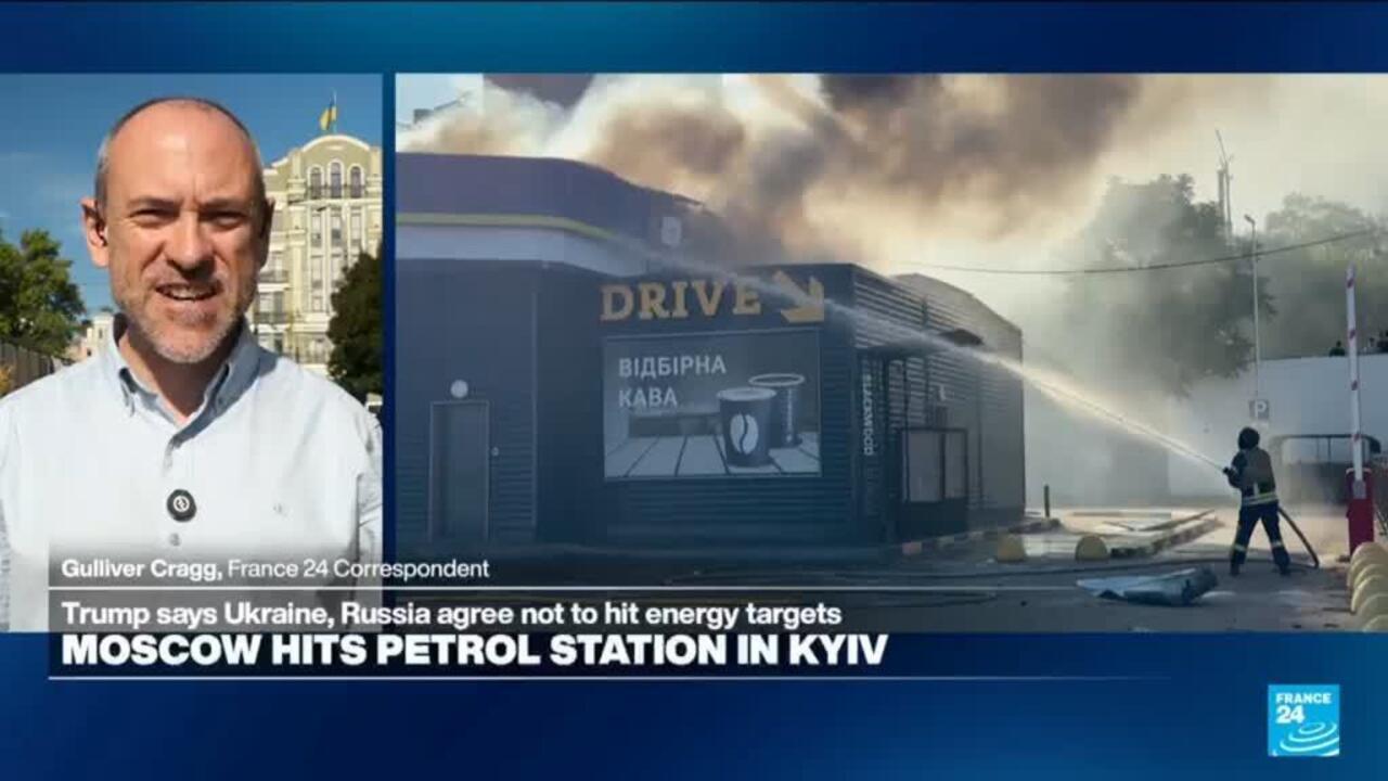 Split-screen news broadcast shows a correspondent beside a smoke-filled petrol station with firefighters spraying water.