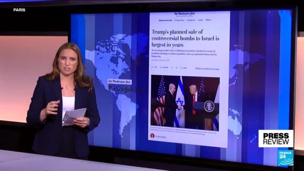 News presenter stands beside a screen displaying a Washington Post article about Israel and Trump.