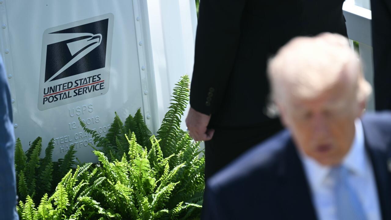 United States Postal Service logo beside ferns and a blurred older man in a suit