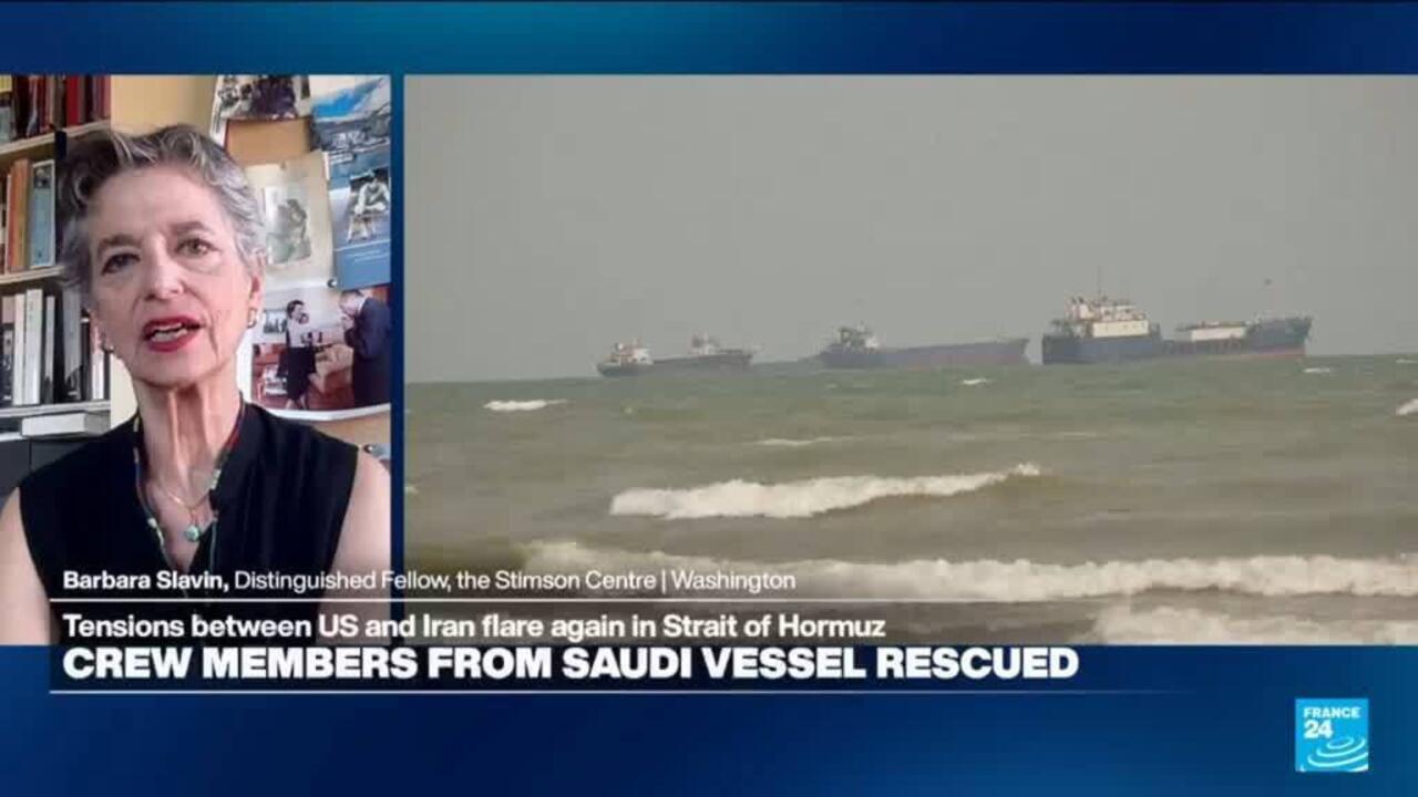 Split-screen news graphic showing a woman speaking beside cargo ships sailing on choppy water.
