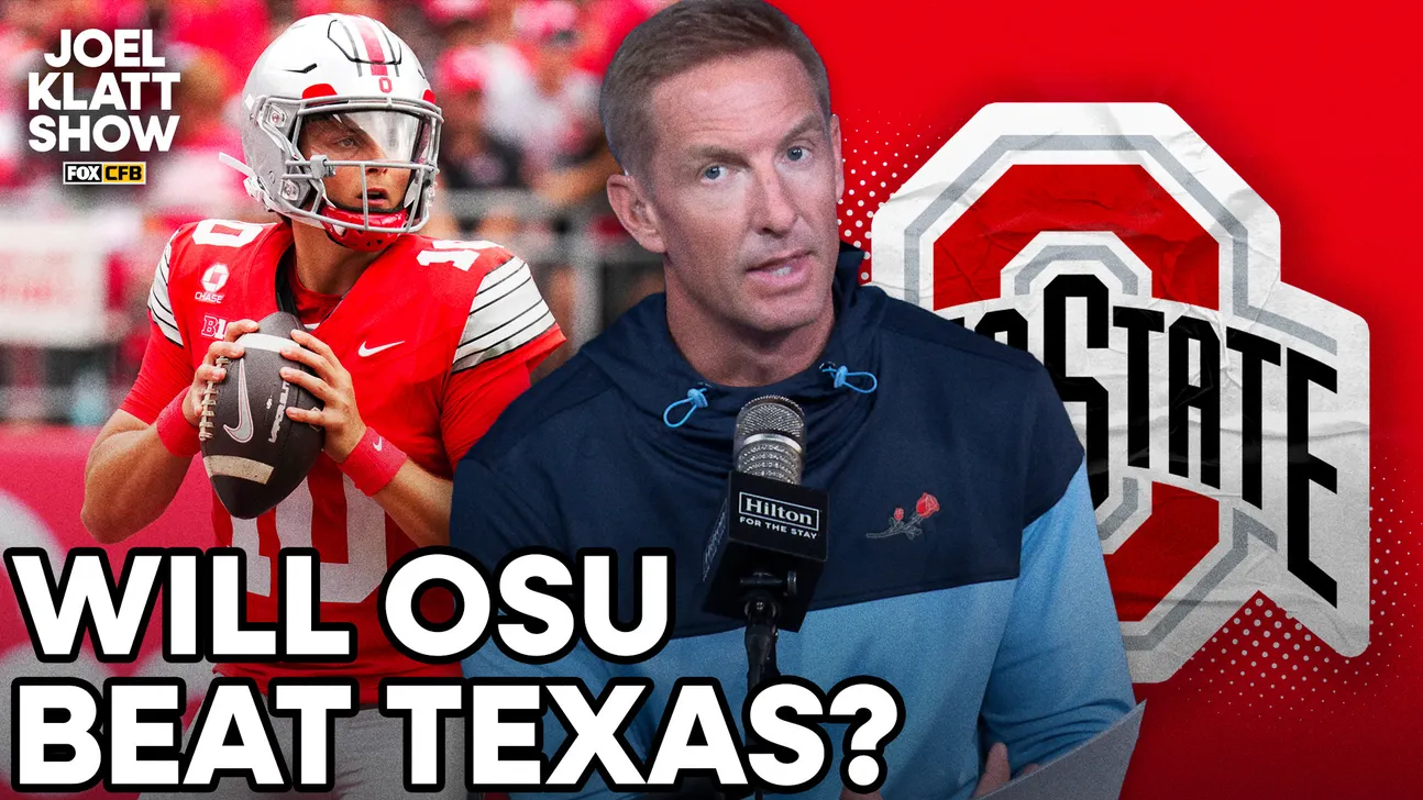Man speaking into microphone beside Ohio State quarterback and large Ohio State logo.