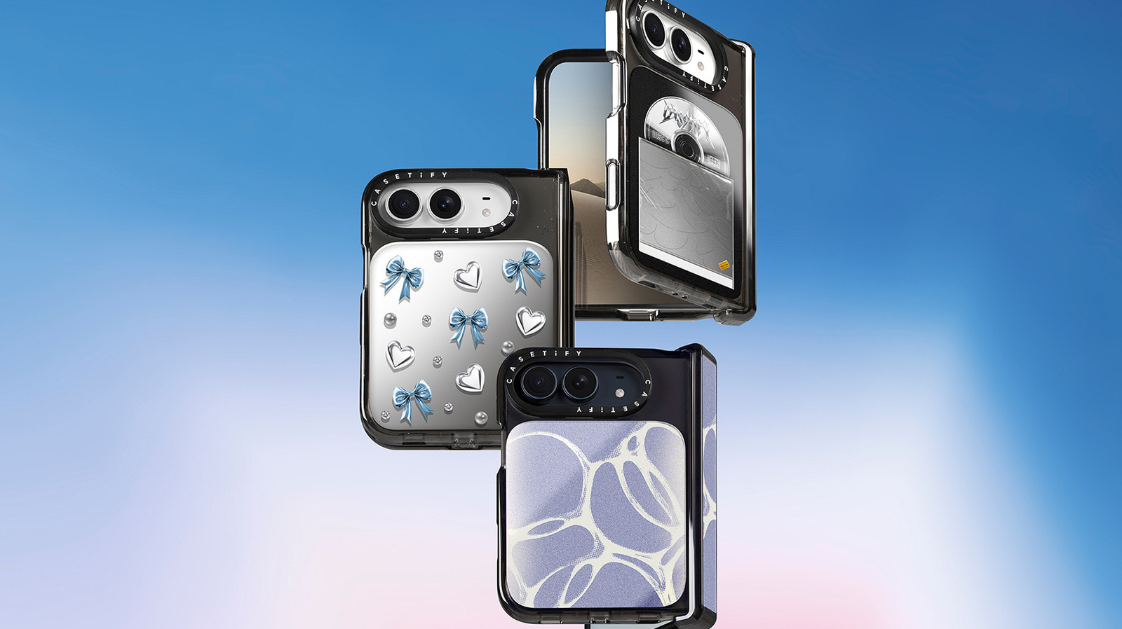 Three foldable phones in decorative protective cases shown against a blue and pink gradient background.