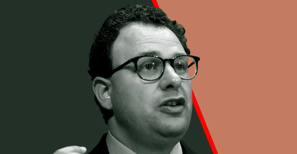 Monochrome portrait of a bespectacled man against dark green and salmon backgrounds with a red diagonal stripe