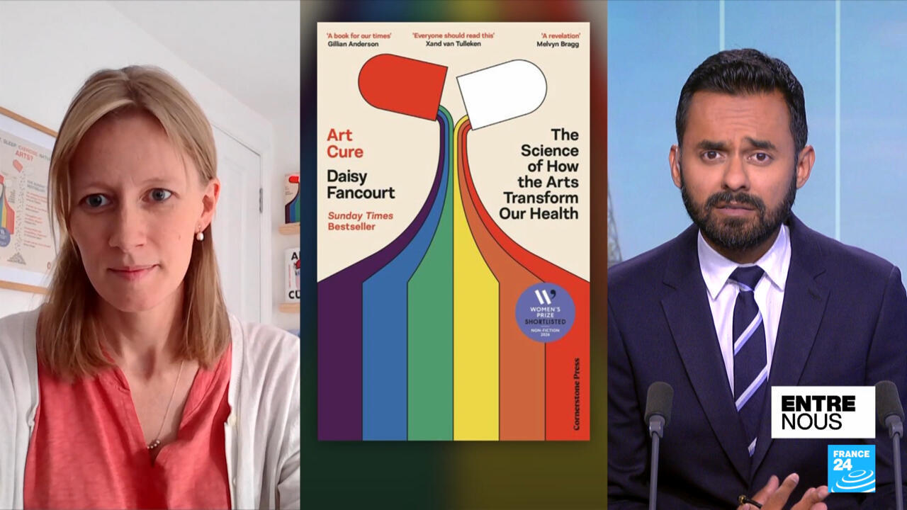 A woman appears beside an Art Cure book cover and a male presenter in a studio.
