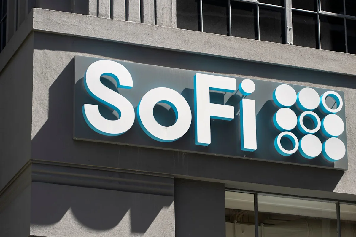 SoFi logo sign mounted on the exterior wall of a modern commercial building.