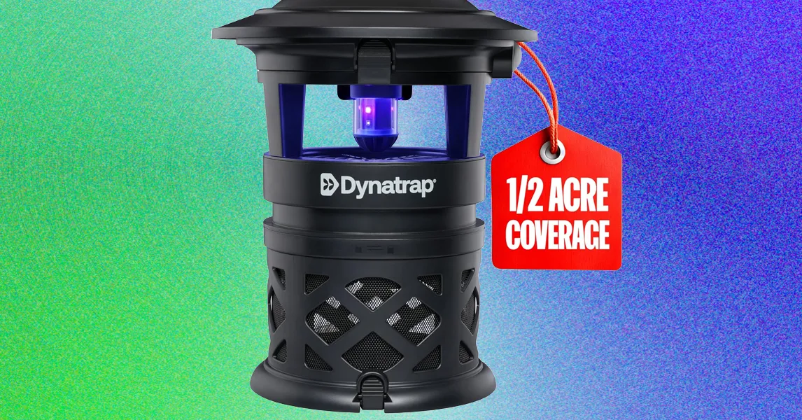 Black Dynatrap insect trap beside a red tag reading “1/2 acre coverage” against a colorful background.