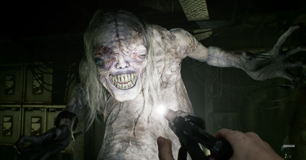A grotesque humanoid creature looms toward a first-person shooter holding a handgun in a dim room.
