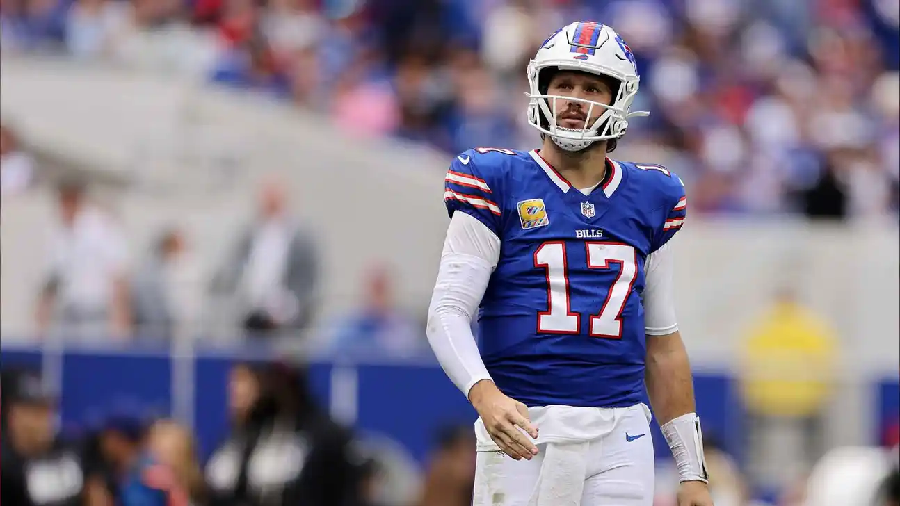 Buffalo Bills player wearing number 17 stands on the field in a white helmet and blue uniform.