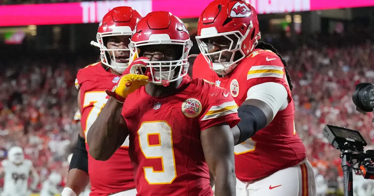 Chiefs players in red uniforms celebrate together, with a player wearing number 9 in the foreground.
