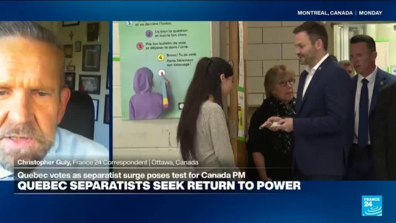 Split-screen news broadcast shows a correspondent beside a politician speaking with people in a classroom.