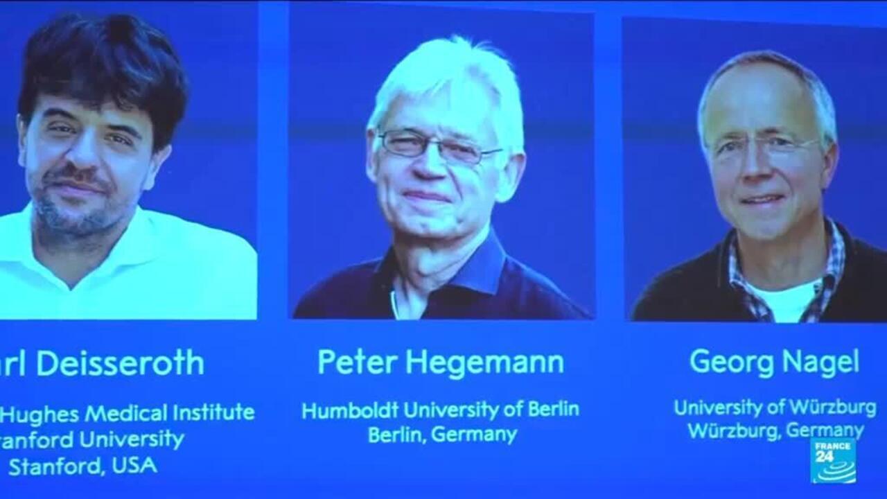 Three men appear in separate portrait panels on a blue screen, with names and university affiliations below.
